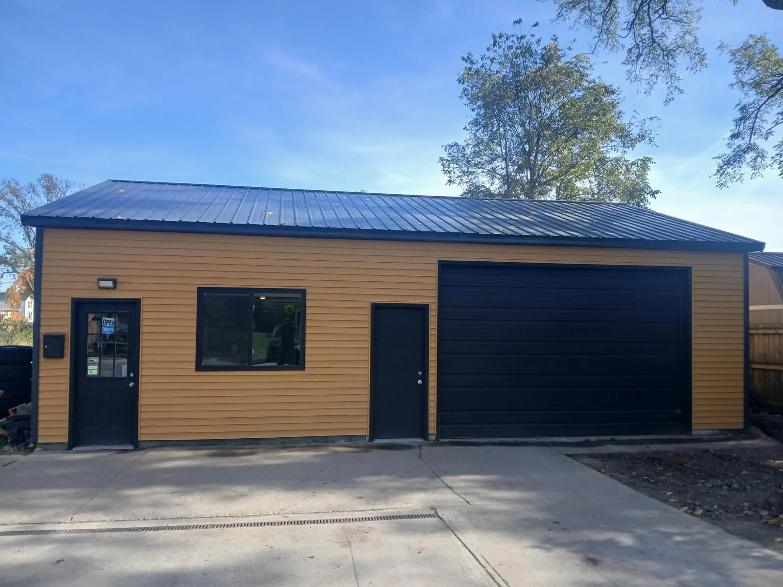 Golden Rule Tire shop exterior with its entrance and service bay